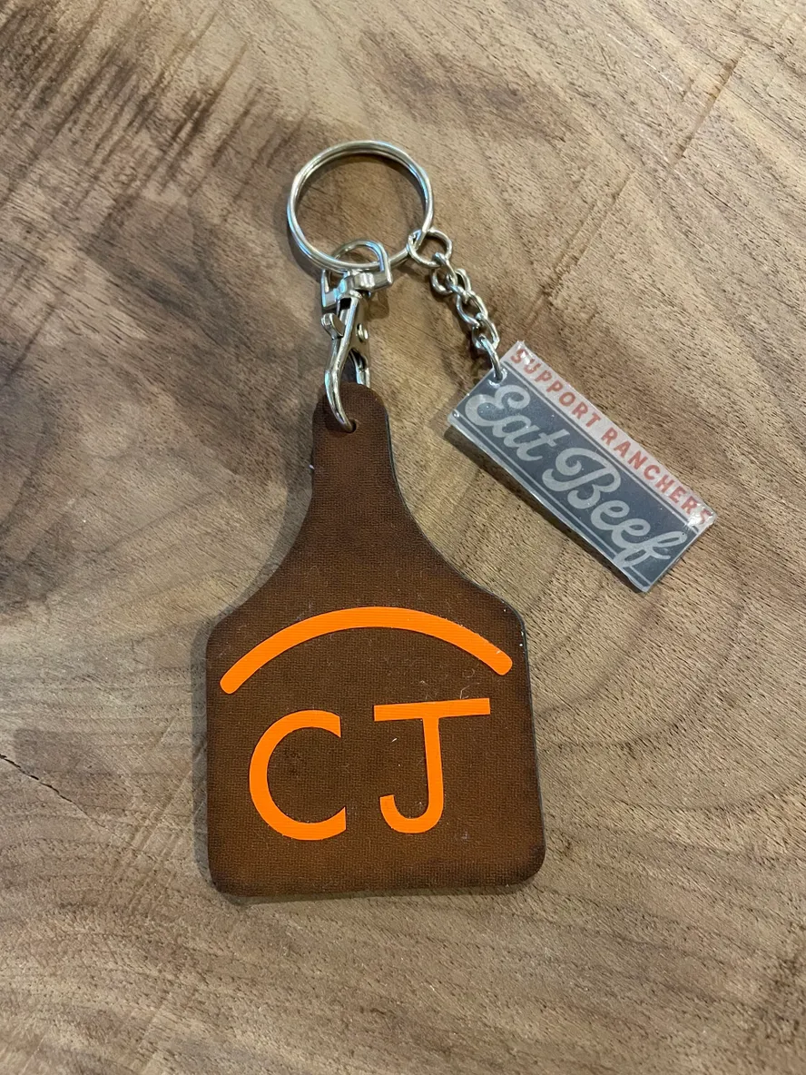 Keychain with "CJ" and "Eat Beef" tags.