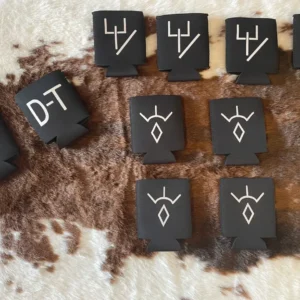 Black can coolers with white symbols arranged.