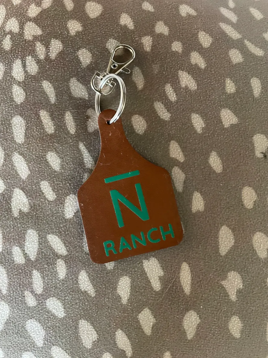 Leather keychain with "N Ranch" logo.