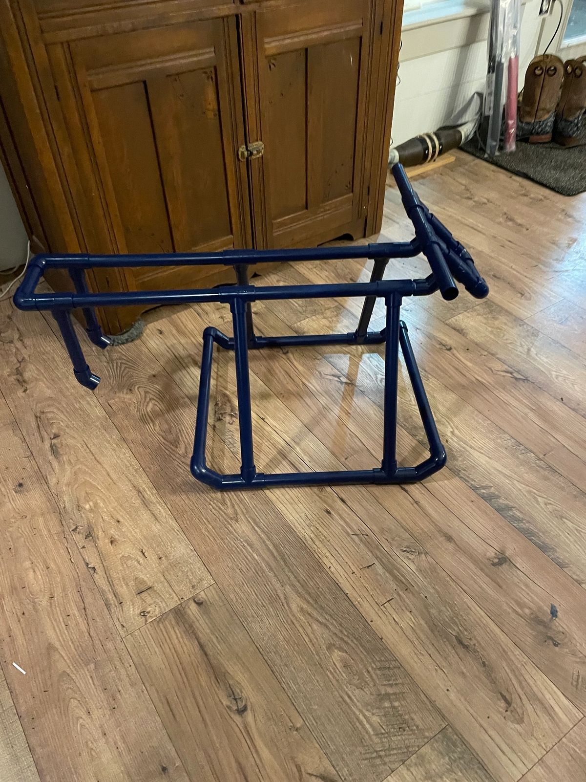 Blue metal frame on wooden floor.