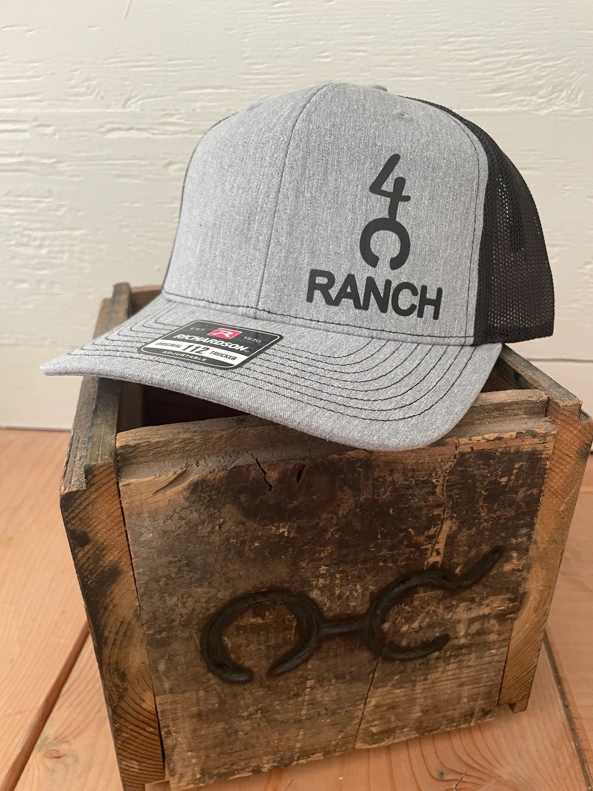 Gray ranch cap on wooden crate.