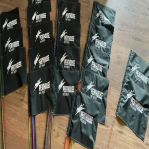 Black flags with Penthouse logo on floor.
